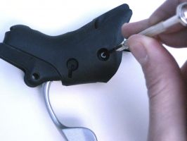 Remove the screw that holds the axle in place Remove the screw that holds the axle in place